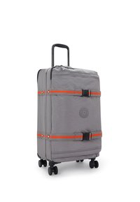 Gray suitcase with orange straps, hard shell, telescopic handle, four black wheels, and logo on front. Smooth texture and rectangular shape.