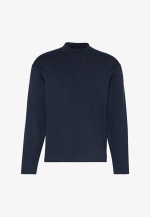 Suéter de manga larga azul marino con cuello alto, textura acanalada y ajuste relajado. Hecho de material de punto suave. Sin adornos visibles.