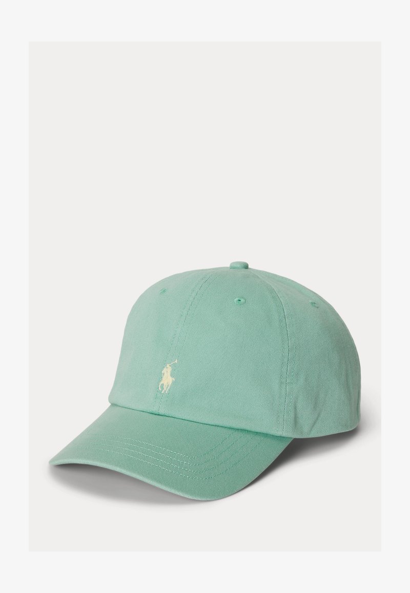 Casquette de baseball vert menthe avec une visière incurvée et un petit logo brodé blanc représentant un joueur de polo sur le panneau avant.