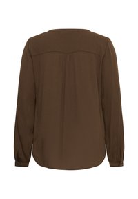 Blouse marron à manches longues avec ourlet arrondi et détail de l’empiècement dos, vue de dos sur fond blanc.