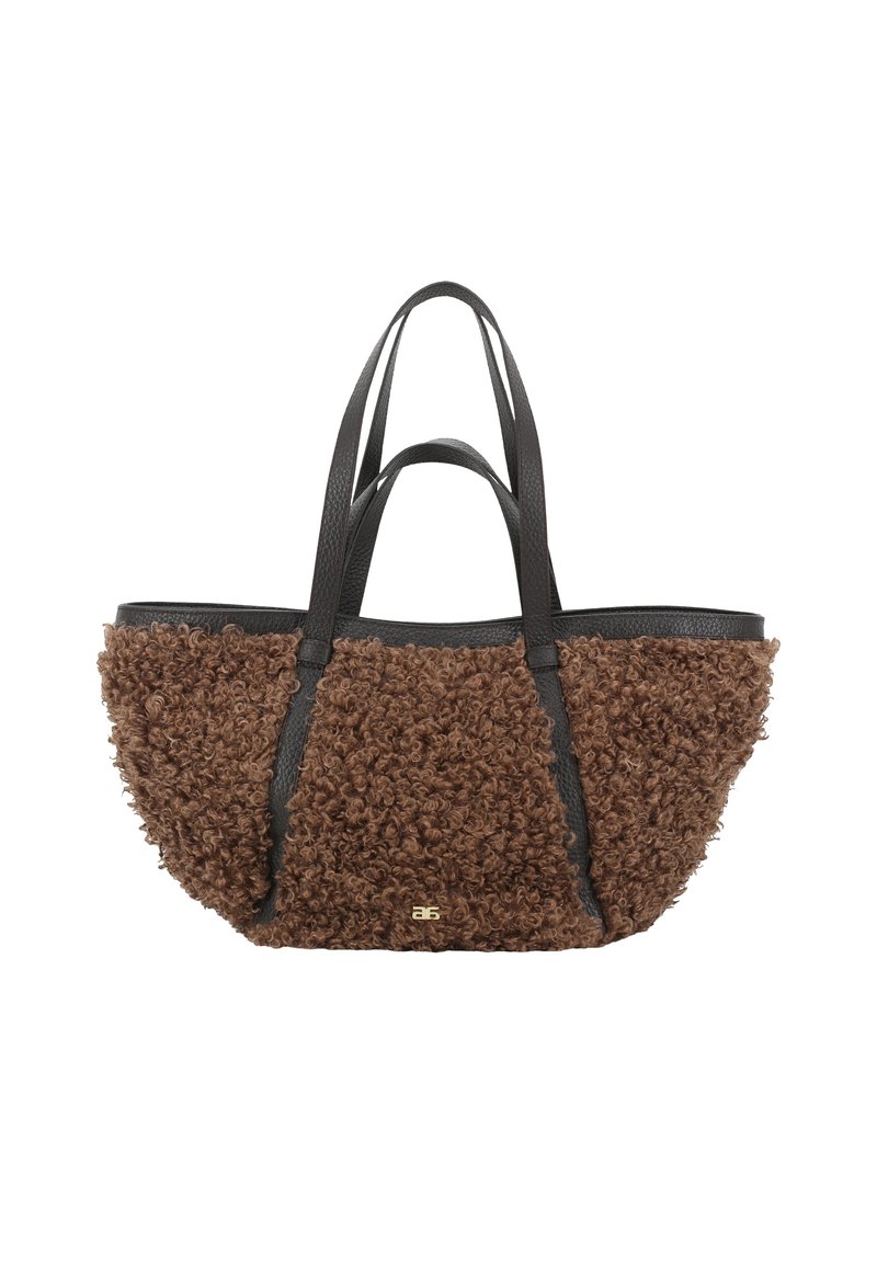 Brown textured tote bag with curly fur-like material on the body and smooth black leather straps; features a gold accent logo.