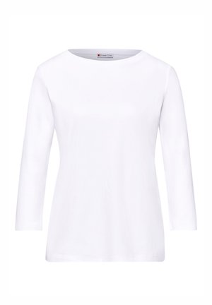 T-shirt blanc à manches longues avec un col rond et un ourlet droit, étiqueté "Street One" à l'intérieur du col.