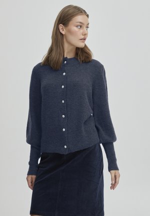Navy wool cardigan with a round neckline and long sleeves, featuring silver-tone buttons down the front and a slightly cropped hem.