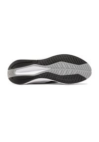 Suela de zapato con un diseño de goma negra y gris, presenta patrones de tracción texturizados y surcos para un mejor agarre, puntera redondeada y tacón curvado.