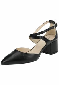 Escarpin en cuir noir avec un bout pointu, une sangle à la cheville et un talon bloc épais. Présente une texture lisse et une semelle intérieure beige contrastante.