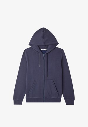 Felpa con zip di colore blu scuro, con tasche frontali, cappuccio con cordino e polsini e orlo a costine, distesa su uno sfondo bianco.