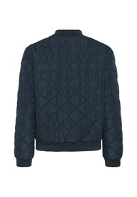 Veste bomber matelassée bleu marine avec surpiqûres en forme de losange, col, poignets et ourlet en maille côtelée, vue de dos.