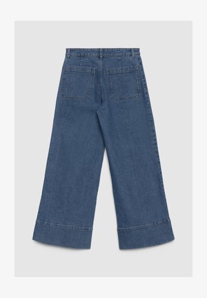 Weit geschnittene Jeans aus Denim in Dunkelblau, mit weicher Textur, zwei Gesäßtaschen und einem rohen Saumabschluss.