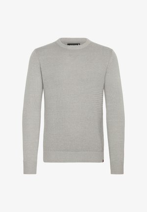 Svetar svetlo sive boje, pleten od rebrastog materijala, sa okruglim izrezom i dugim rukavima. Sadrži suptilne detalje duž ivica i manžeta.