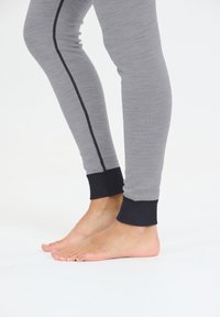 Grå leggings med en slim fit, med en sort side stripe og sorte manchetter ved anklerne. Blød, glat tekstur, egnet til aktivt tøj.