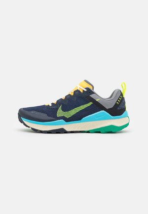 Mørkeblå og grå løbesko med neongrøn swoosh, lyseblå mellemsål, cremefarvet ydersål og gul hælkappe.