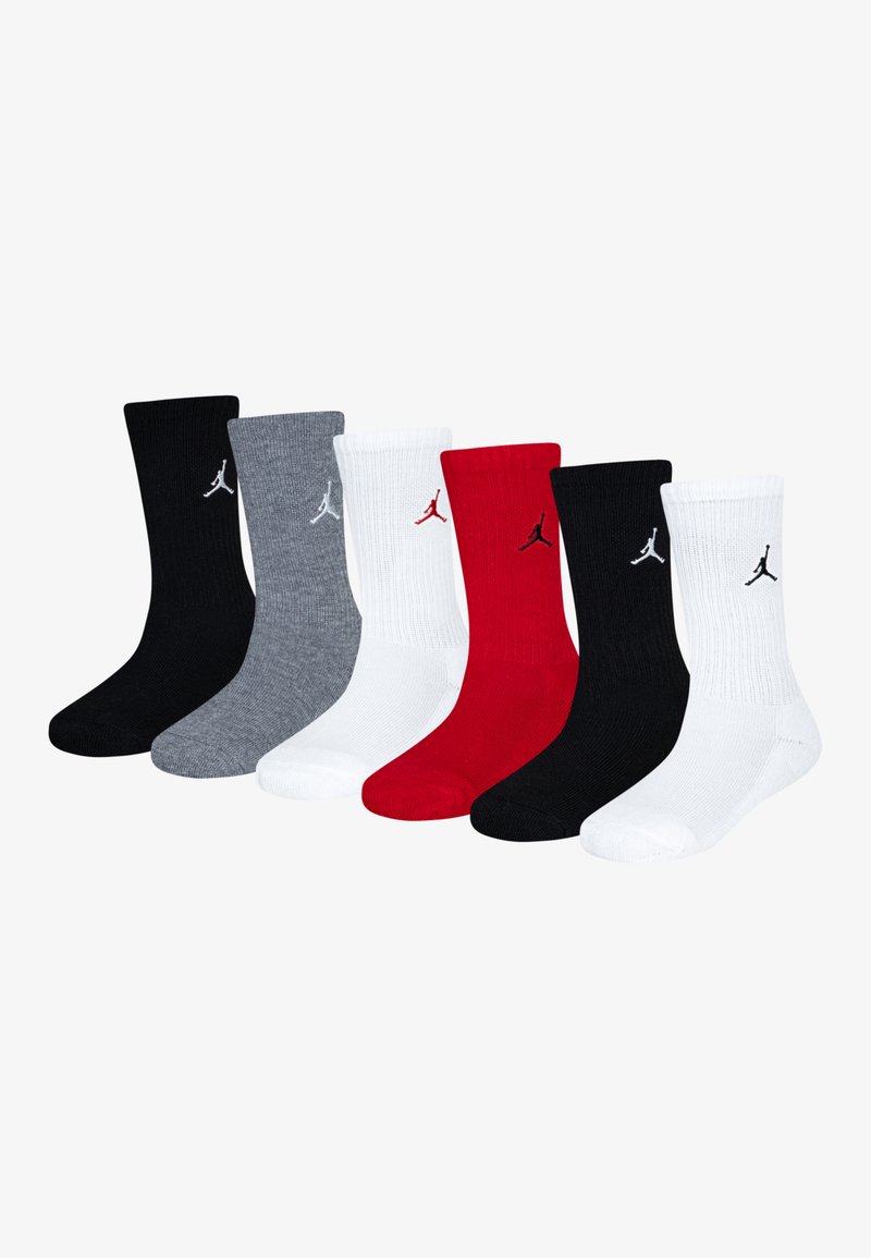 Six paires de chaussettes mi-mollet en noir, gris, blanc et rouge. Chaque chaussette présente un petit logo Jordan noir et une texture côtelée.