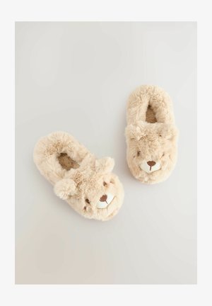Pantofole in morbido feltro beige, progettate come facce di orso, con orecchie 3D, occhi ricamati e un rivestimento accogliente per calore e comfort.