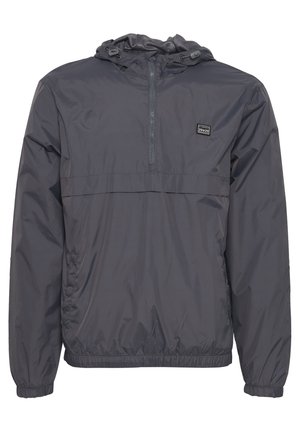 Harmaa, kevyt, hupullinen vetoketjullinen takki, jossa on puolivetoketju ja joustavat hihansuut. Rinnassa on pieni logo-ompelu.