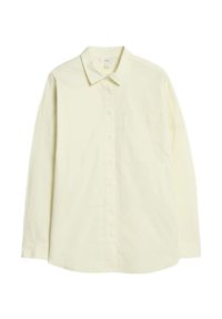 Chemise à manches longues jaune clair en coton, avec un devant à boutons, un col et une poche à la poitrine gauche. Texture lisse, coupe standard.
