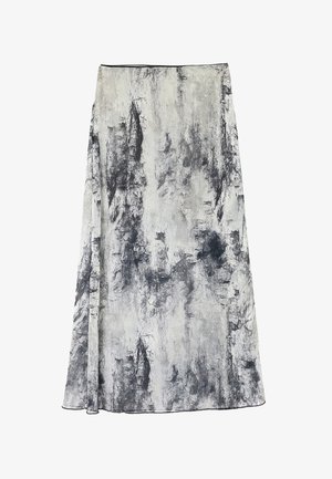 A knee-length skirt made from lightweight fabric featuring a textured black and white abstract pattern with a flowing drape.