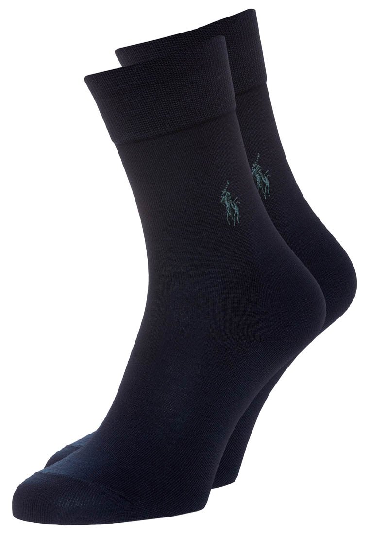 Tamsiai mėlynos medvilnės mišinys kojinės su raukšlėtu kraštu ir subtiliu žaliu logotipo akcentu. Turtingas lygus paviršius ir standartinio kulkšnies auk�ščio.