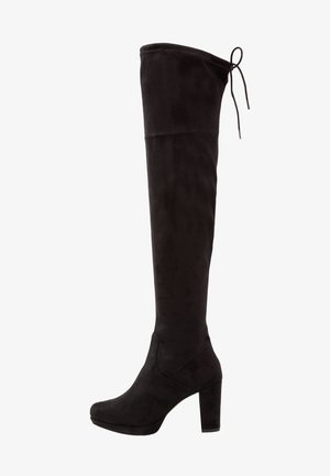 Bottes noires en daim au-dessus du genou avec un haut talon carré, un bout arrondi et un détail de lacet ajustable en haut. Texture lisse tout au long.
