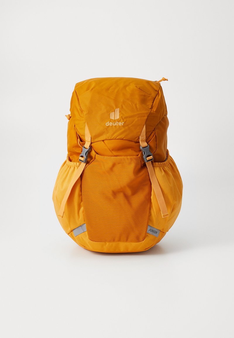 Orange backpack with a textured finish, featuring adjustable straps, side pouches, and a reflective accent labeled "JUNIOR."