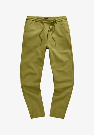 Pantalones jogger ajustados de color verde oliva con cinturilla elástica, cordón, bragueta con cremallera, cierre de presión y bolsillos laterales sobre fondo blanco.