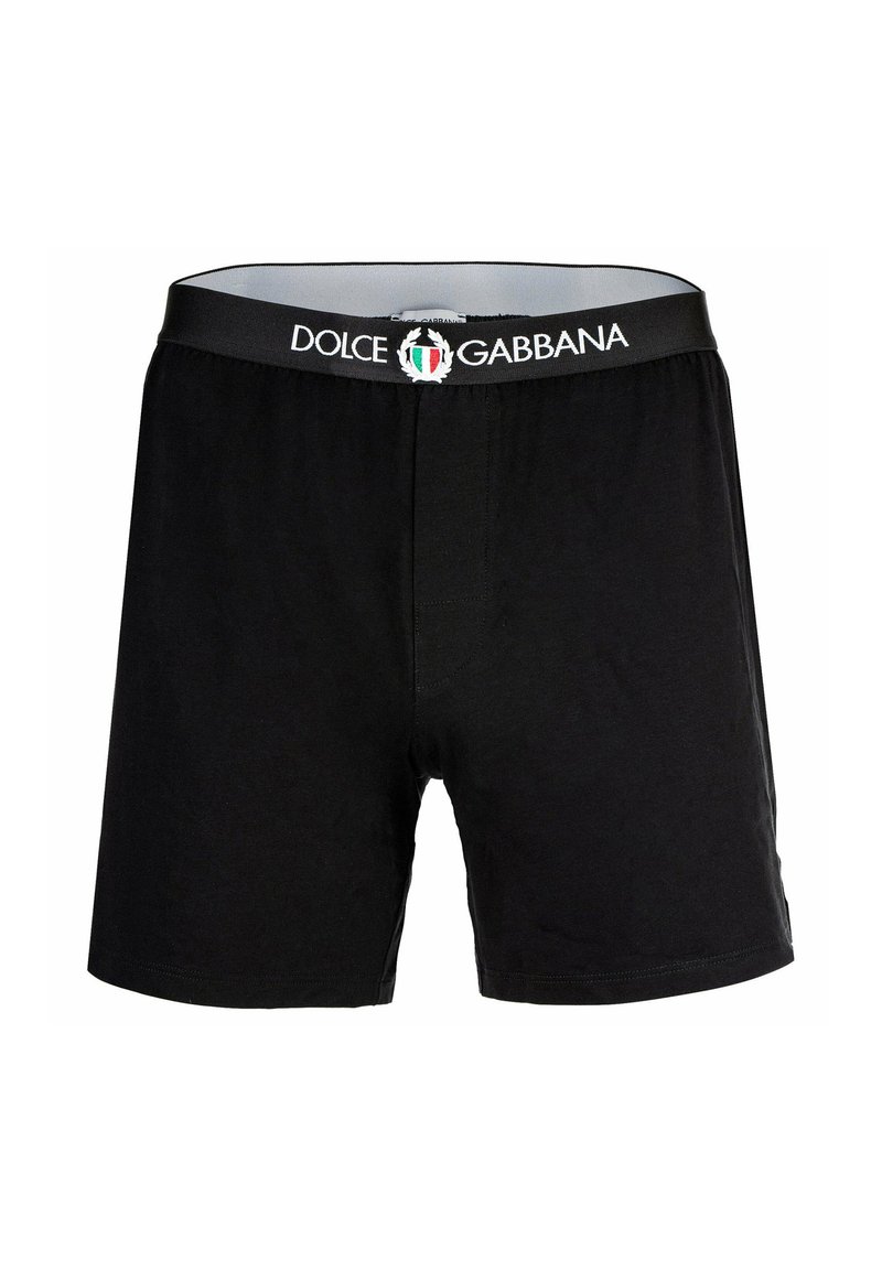 Svarta bomullboxershorts med en elastisk midjeband med "Dolce & Gabbana"-logotyp och emblem. Slät textur, klassisk design.