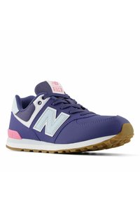 Purple and white New Balance 574 sneaker with pink accents, mesh panels, and gum rubber sole shown at a right-side angle.