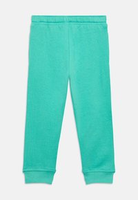 Τιρκουάζ παντελόνι φόρμας με απαλή υφή, ελαστική μέση και μανσέτες στους αστραγάλους, με απλό σχέδιο χωρίς μοτίβα ή διακοσμητικά.