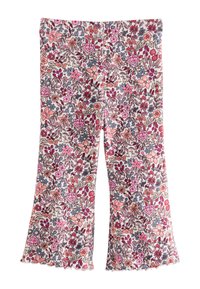 Blommönstrade bell-bottom-byxor med vit bakgrund, prydda med rosa, röda och blå blommor. Mjukt tyg med volangkant.