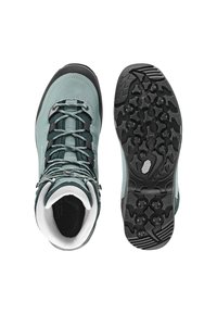 Scarpe da trekking azzurro chiaro con suole in gomma nera, dotate di un motivo di grip testurizzato, lacci e colletto imbottito per il supporto.