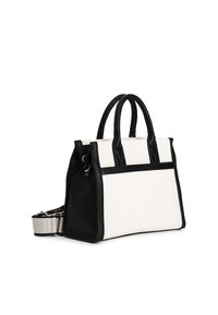Czarna i biała torba na ramię wykonana z płótna i skóry, z podwójnymi uchwytami, odpinanym paskiem oraz usztywnioną konstrukcją z kontrastującymi akcentami.