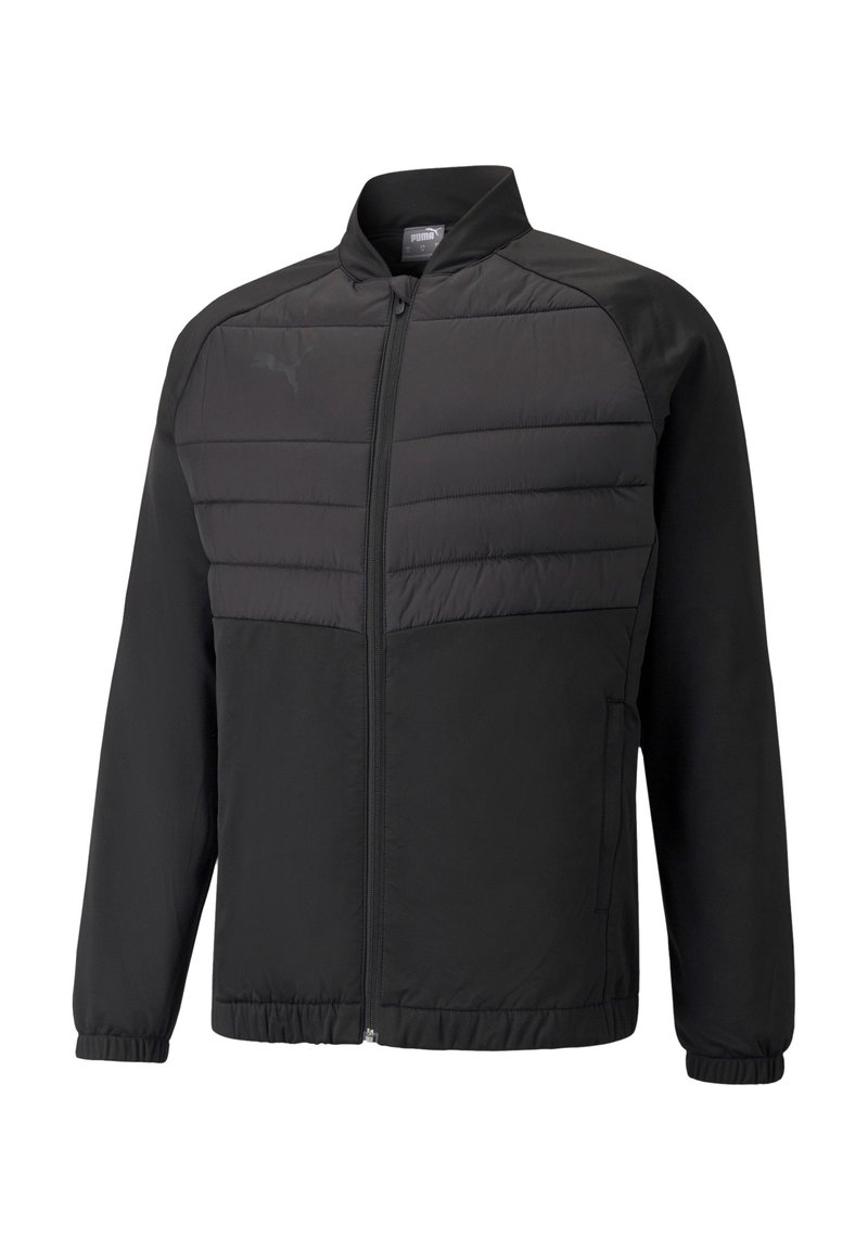 Veste légère noire avec fermeture éclair à l'avant, présentant un design en panneaux matelassés sur le haut du corps et des poignets élastiques. Logo PUMA sur la poitrine gauche.