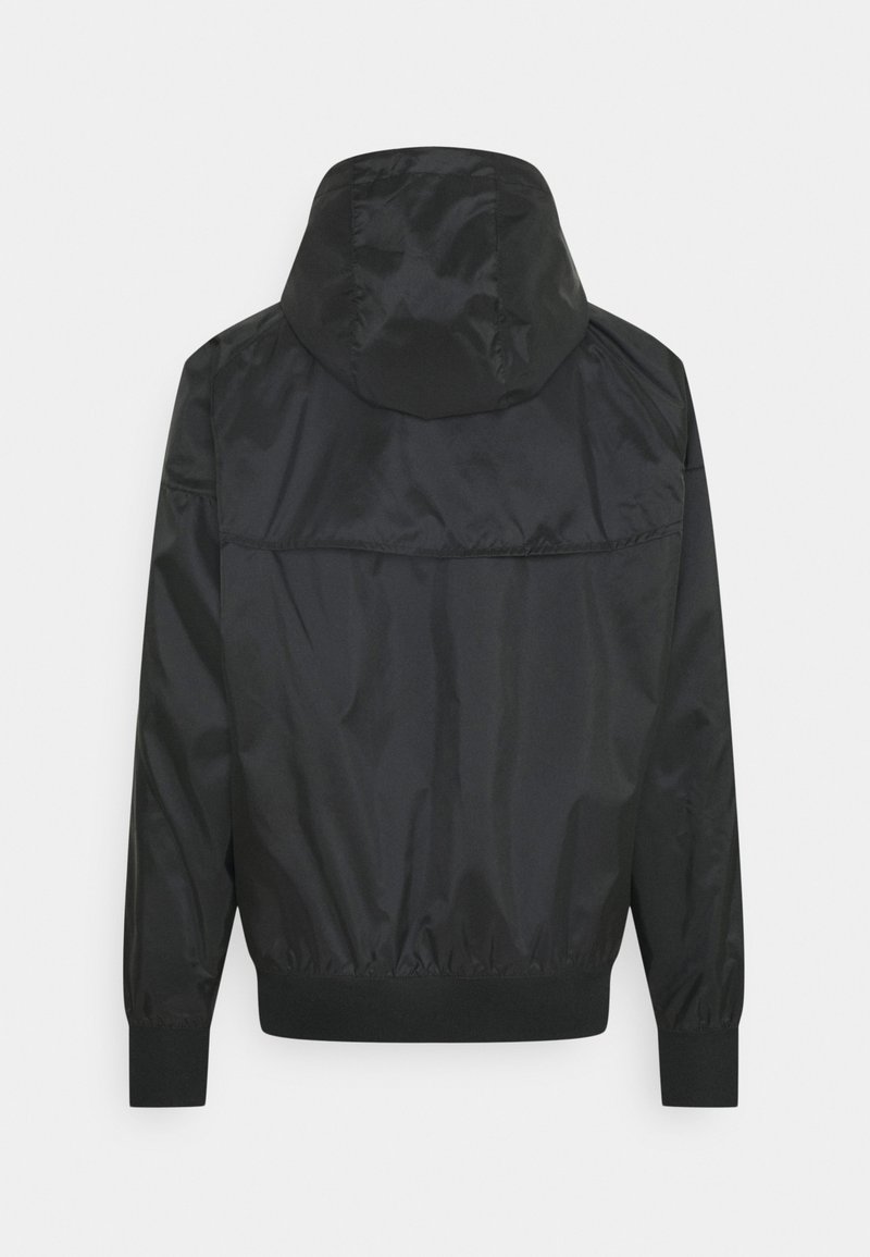 veste nike blanche et noir
