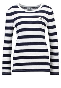 Morska i biała, w paski, koszula z długim rękawem, okrągły dekolt, z małym haftowanym wzorem dwóch oczu na klatce piersiowej.