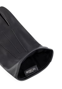 Schwarzer Lederhandschuh mit drei dekorativen Nählinien auf der Rückseite, weichem Innenfutter und einem Etikett mit der Aufschrift "ROECKL MÜNCHEN".