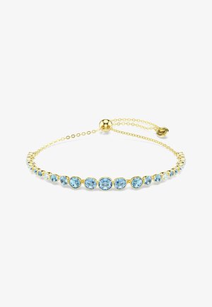 Bracelet chaîne en or avec pierres précieuses bleues rondes alignées, fermoir coulissant ajustable, présenté sur fond blanc.