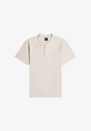 Polo beige à manches courtes avec trois boutons et un col, posé à plat sur fond blanc.