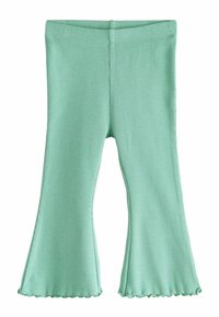 Zöld bordázott, harang alakú nadrág fodros szegéllyel. Puha textúra, rugalmas derékpánt és könnyű anyag a mozgás szabadságához.