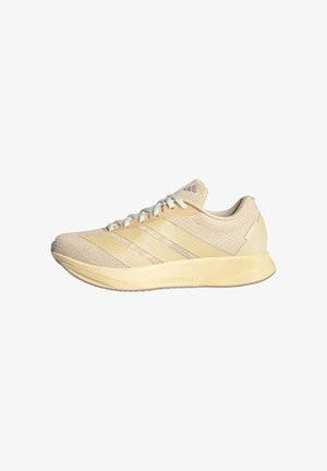 Scarpa da running color beige chiaro con tomaia in mesh, tre strisce tonali sul lato, lacci bianchi e suola ammortizzata con la scritta "Lightmotion."