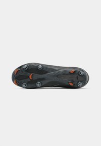 Black football cleat with textured rubber sole, featuring six circular studs and orange accents. Lightweight design for traction and stability.