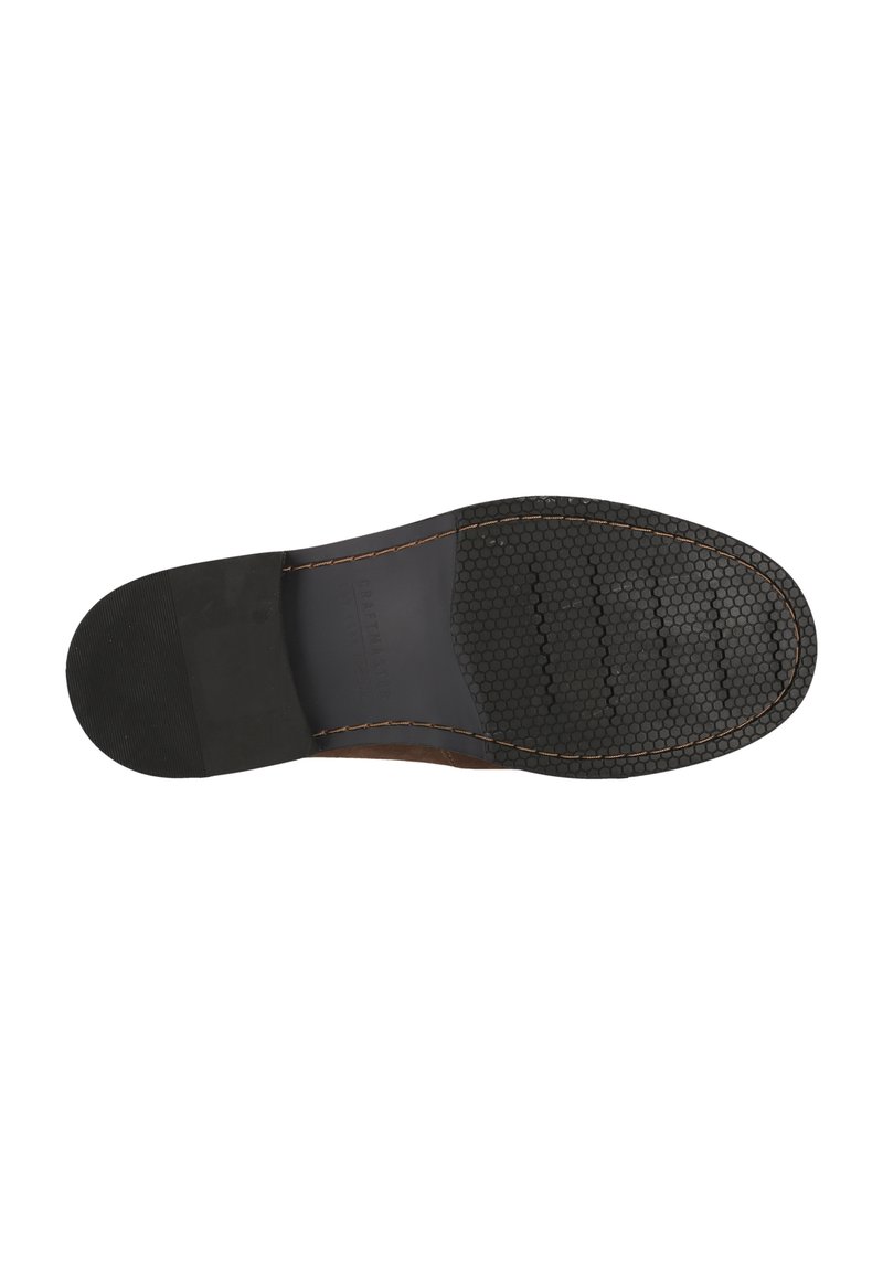 Semelle en caoutchouc noir avec une texture hexagonale, présentant un bord en cuir marron et des coutures visibles tout autour.