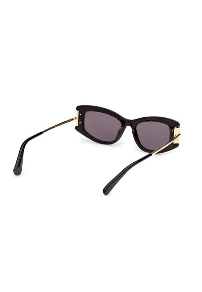 Black cat-eye sunglasses with dark lenses and gold accents on the temples, displayed against a white background.