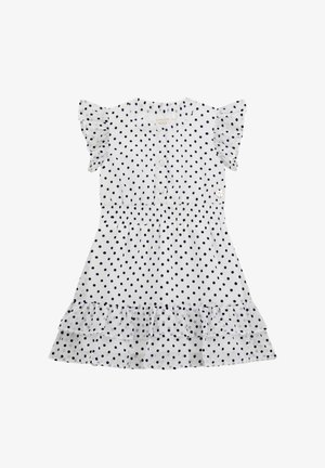 Robe blanche à manches courtes avec des pois noirs, poitrine boutonnée, taille élastique, manches et ourlet à volants, et un logo en forme de cœur sur la poitrine.