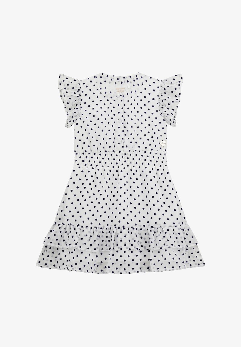 Robe blanche à manches courtes avec des pois noirs, poitrine boutonnée, taille élastique, manches et ourlet à volants, et un logo en forme de cœur sur la poitrine.