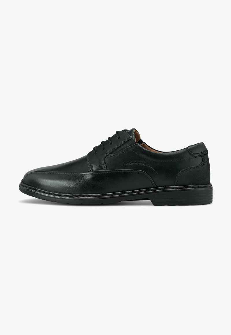 Scarpa da uomo in pelle nera, con punta rotonda, sei fori per i lacci, dettagli cuciti e suola in gomma nera. Texture liscia con una finitura lucida.