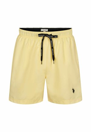 Gelbe Badehose aus leichtem Stoff. Verfügt über einen elastischen Bund mit verstellbarem schwarzen Kordelzug und einem schwarzen Logoakzent.