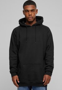 Felpa nera in cotone con tasca frontale, cappuccio con lacci e polsini a costine. Il design è semplice e privo di ornamenti, offrendo un look casual.