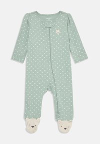 Green onesie made of soft fabric, featuring white heart patterns, long sleeves, a snap closure, and bear face accents on the feet.