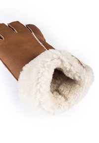 Brown leather glove with a cream faux fur lining and cuff. Features three finger openings and decorative white stitching. Soft texture.