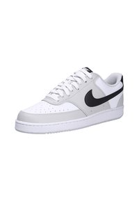 Gray and white Nike sneakers with a smooth leather upper, round toe, perforations, white laces, and a black swoosh logo on the side.