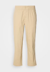 Pantalon décontracté beige avec taille élastique et fermeture par bouton, coupe droite, présenté à plat sur un fond blanc.